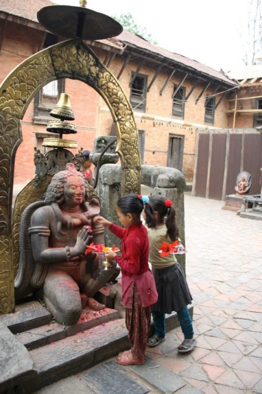 children making offerings, Nepal